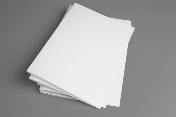 istock Blank portrait mock-up paper. brochure magazine isolated on gray, changeable background / white paper isolated on gray 972764172