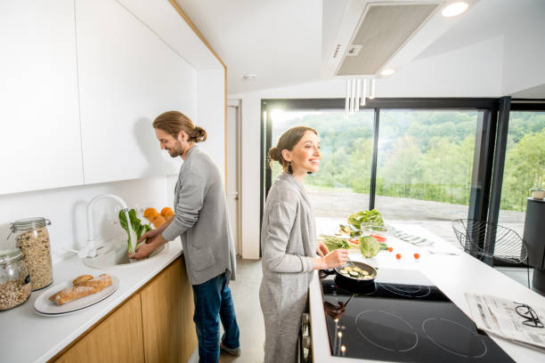 istock Couple cooking food at the kitchen home 972774998