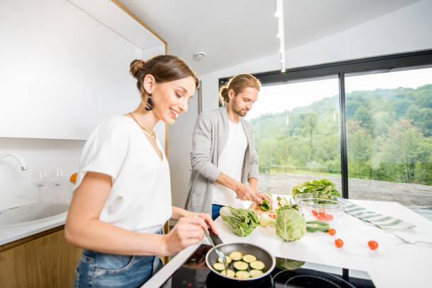 istock Couple cooking food at the kitchen home 972775026
