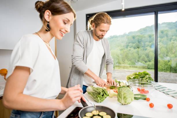 istock Couple cooking food at the kitchen home 972775054