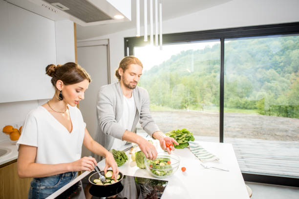 istock Couple cooking food at the kitchen home 972775258