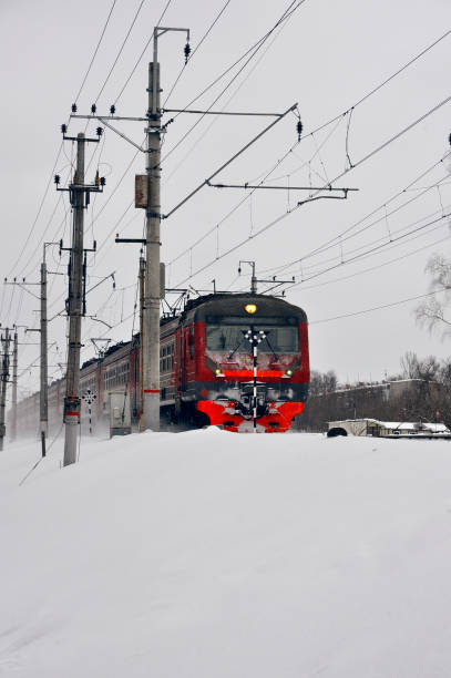 Red train on the railway in winter stock photo