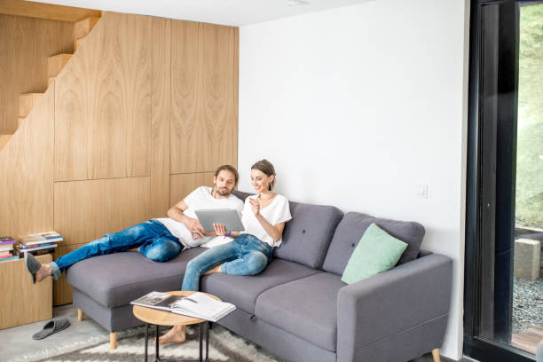 istock Couple on the couch at home 972778632