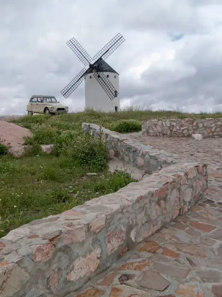 Don Quixote's windmill with old retro Citroen car