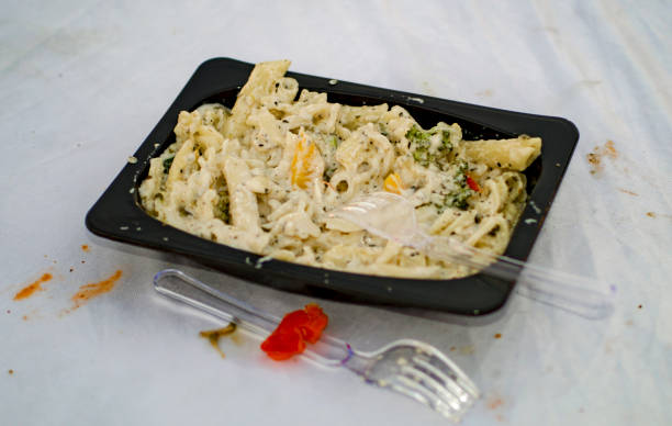 istock White leftover dirty pasta with cream and sauce 972778964