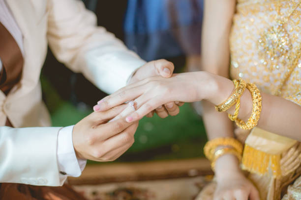 istock Thai people wearing wedding ring at wedding day. 972785050