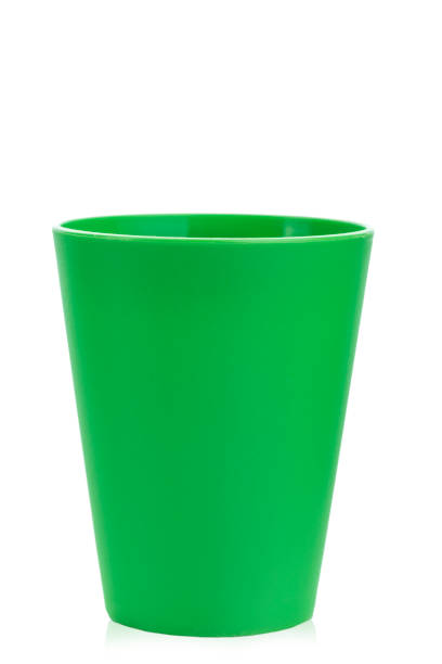 istock colored plastic glass for children's holiday on a white background isolated. 972794480