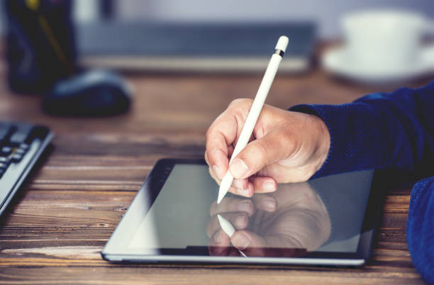 istock Digital Signature Concept with Tablet and Stylus Pen 972812418