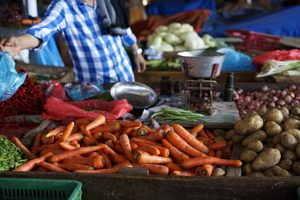 istock Vegetable Vendor selling Fresh Organic carrot 972820780
