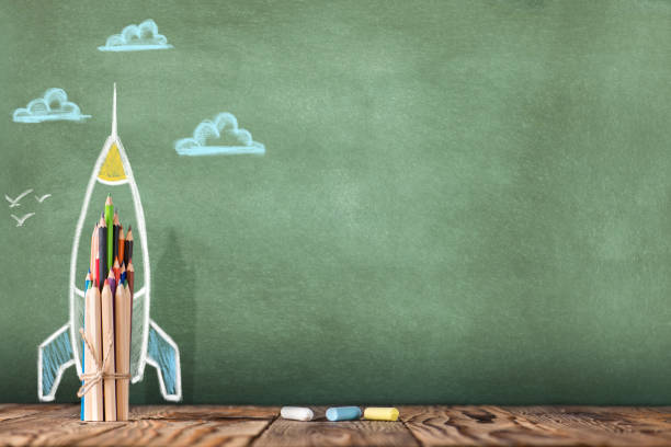 istock Back to School Concept with Hand Drawn Rocket on Blackboard 972836068