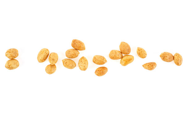 istock Roasted salted peanuts isolated on a white background, top view. 972836210