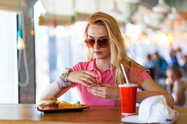 istock Young pretty woman resting in cafe 972836382