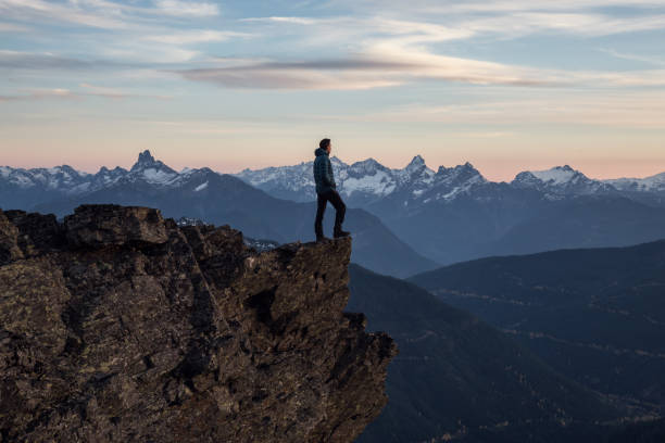 istock Adventurous Man on top of Mountain 972838722