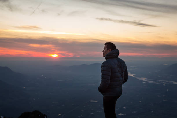 istock Adventurous Man on top of Mountain 972839008