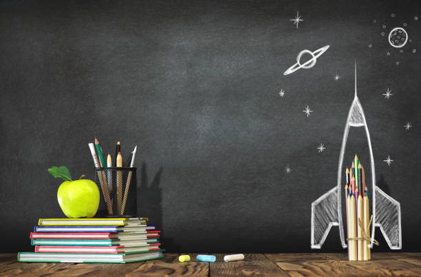 istock Back to School Concept with Hand Drawn Rocket on Blackboard 972842026