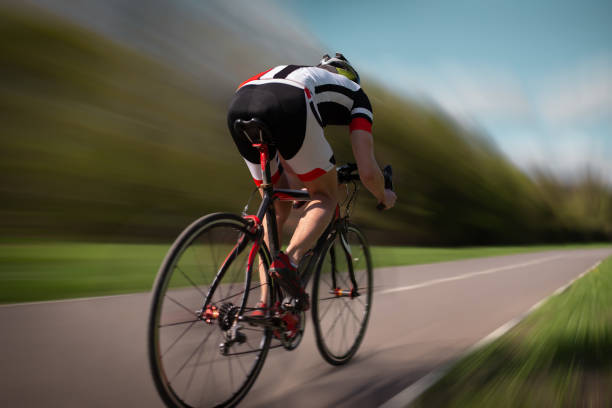 istock Cyclist rides on bicycle, speed effect 972842874