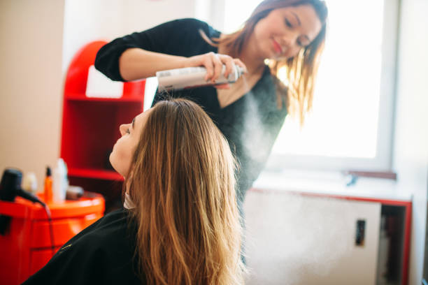 istock Stylist is preparing to apply mousse, hairdressing 972846050