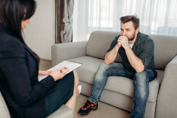 istock Sad patient at psychologist, psychology support 972851924