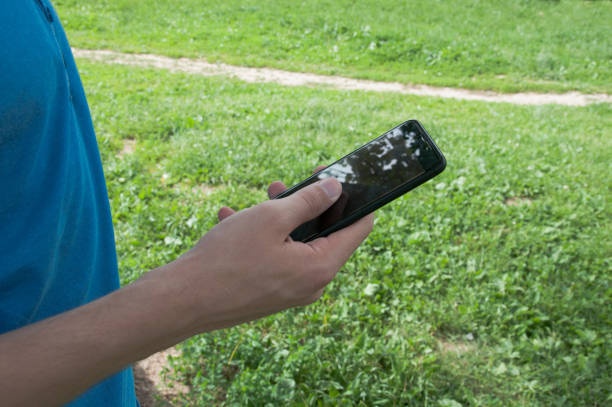istock Man holding a smartphone 972852944