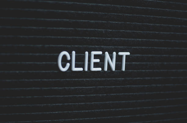 istock Word client written on the letter board. 972869748