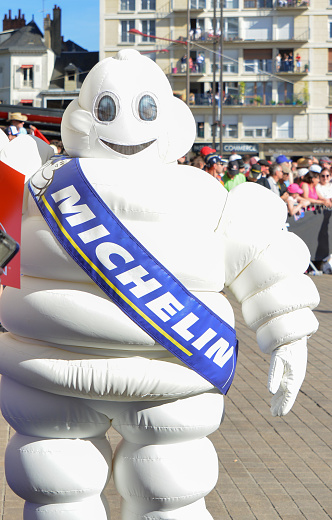 LE MANS, FRANCE - JUNE 16, 2017: White inflatable man - emblem of the company Michelin on a parade of pilots racing at Le mans, France
