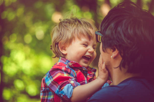 istock Family enjoying summer in park 972880438