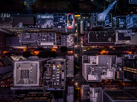 The roof tops of buildings in the city at dusk