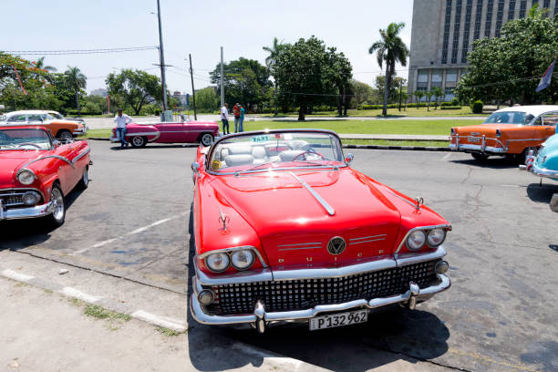Old restored American car cruising the streets of Havana at night