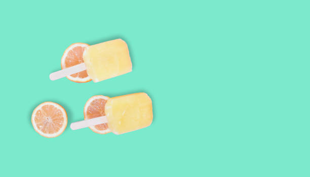 yellow sticky ice cream on the green pastel color background