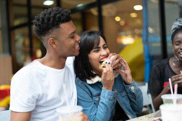 istock Group of young people having fun in a restaurant 972911834
