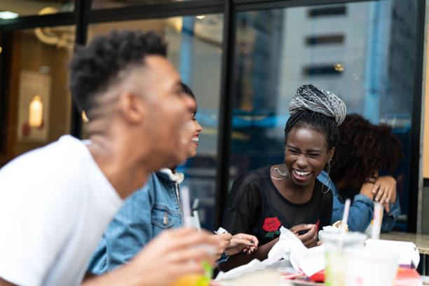 istock Group of young people having fun in a restaurant 972911856