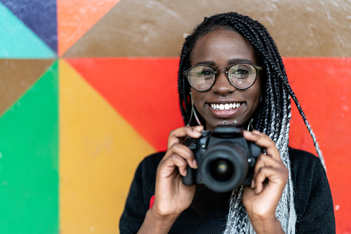 Portrait of a photographer Smiling with Colorful background