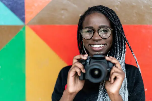 Photo of Portrait of a photographer Smiling with Colorful background