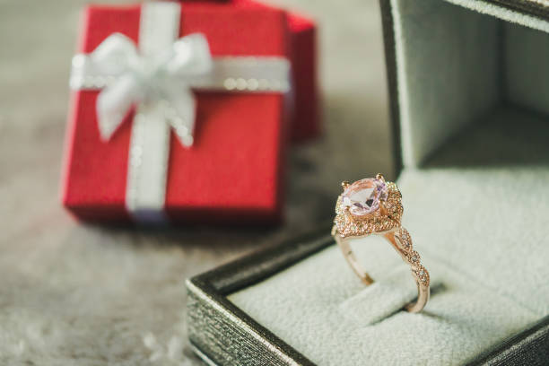 istock jewelry pink diamond ring with red gift box background 972919172