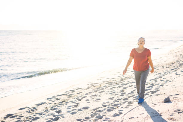 istock Senior woman at the beach 972921644