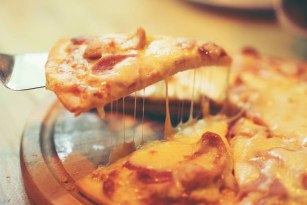 istock Homemade Pizza on a rustic wooden table. 972921862