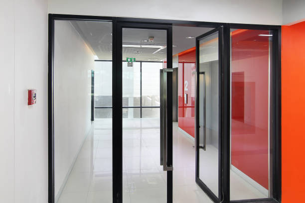 istock Fire alarm near first  floor elevator and emergency exit of the building 972937060
