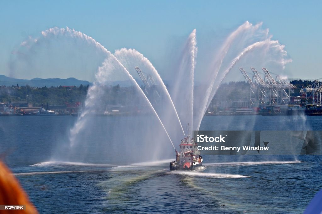 FIRE TUG A boat used to fight fires from the water, displays her abilities during Seattle’s Sea Fair. Fleet Week Stock Photo