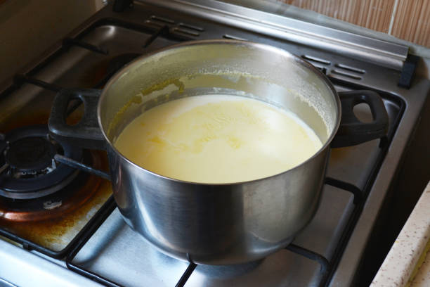istock Boiling milk in saucepan 972946660