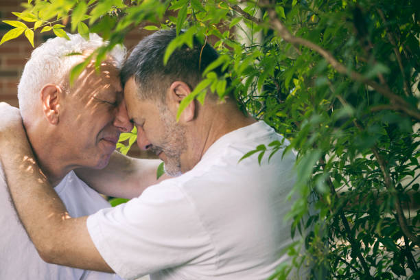 istock loving middle aged gay couple 972951100