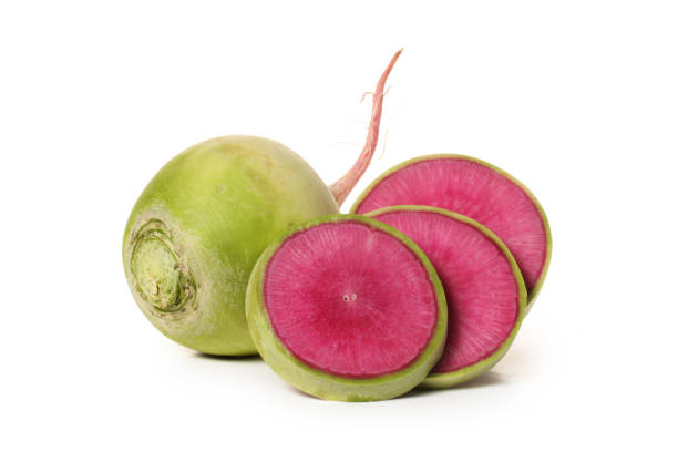 istock One whole and sliced watermelon radish isolated on white background 972951292