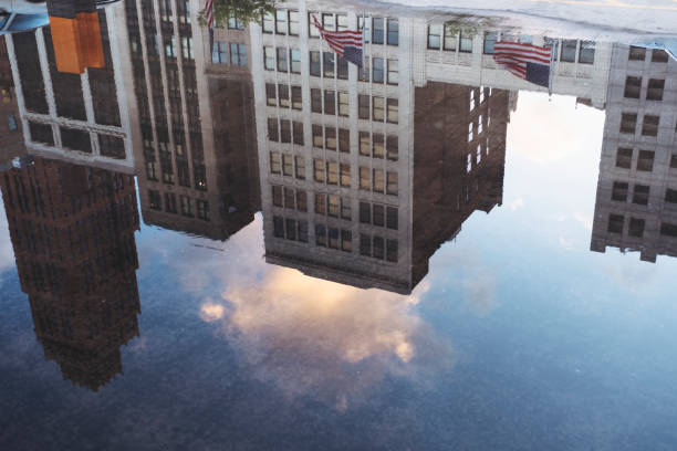 istock Detroit skyline reflection in puddle off water 972959418