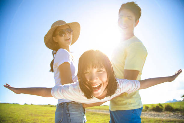 An outdoor portrait of a group of beautiful diverse children. Kids smiling and looking at the camera
