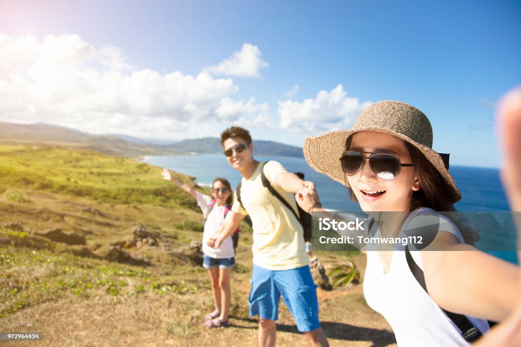 happy family taking selfie on the coast Family Stock Photo