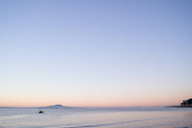 Early morning Kayaking with Rangitoto Island in Background. Early morning Kayaking with Rangitoto Island in Background, Auckland, New Zealand. rangitoto island stock pictures, royalty-free photos & images