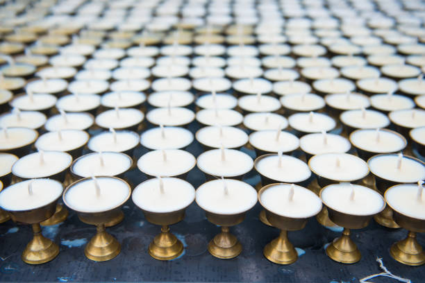 istock Wax candles on candlestick in temple 972974022