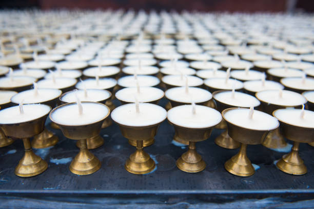 istock Wax candles on candlestick in temple 972974042