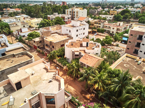 Aerial Drone view of niarela Bamako Mali Bamako is the capital and largest city of Mali, with a population of 1.8 million. In 2006, it was estimated to be the fastest-growing city in Africa and sixth-fastest in the world. It is located on the Niger River, near the rapids that divide the upper and middle Niger valleys in the southwestern part of the country. mali stock pictures, royalty-free photos & images