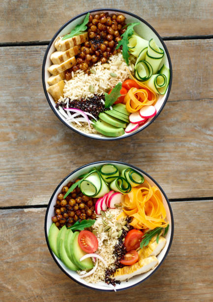 istock Top view two buddha bowl on wooden table 972991308