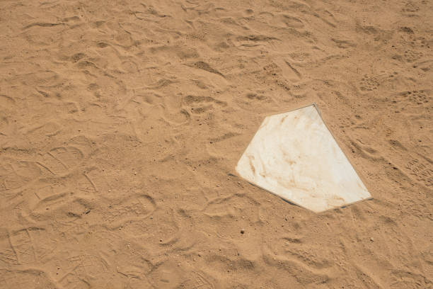 istock baseball softaball diamond field white home base close up 973003536